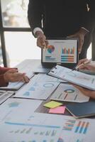 Finance manager meeting discussing company growth project success financial statistics, professional investor working start up project for strategy plan with document, laptop and digital tablet. photo