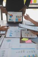 Finance manager meeting discussing company growth project success financial statistics, professional investor working start up project for strategy plan with document, laptop and digital tablet. photo