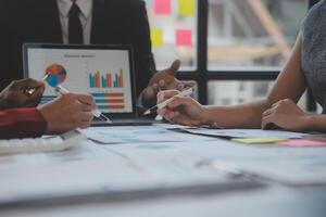 Finance manager meeting discussing company growth project success financial statistics, professional investor working start up project for strategy plan with document, laptop and digital tablet. photo