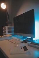 Laptop and paperwork on conference table photo