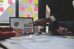 Finance manager meeting discussing company growth project success financial statistics, professional investor working start up project for strategy plan with document, laptop and digital tablet. photo