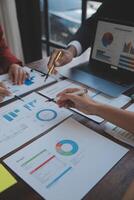 Finance manager meeting discussing company growth project success financial statistics, professional investor working start up project for strategy plan with document, laptop and digital tablet. photo