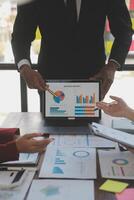 Finance manager meeting discussing company growth project success financial statistics, professional investor working start up project for strategy plan with document, laptop and digital tablet. photo