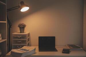 Laptop and paperwork on conference table photo