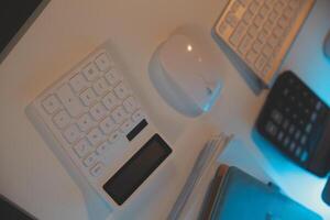 Laptop and paperwork on conference table photo