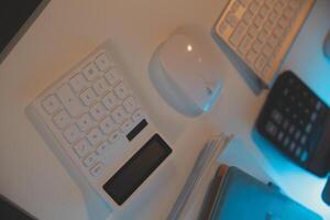 Laptop and paperwork on conference table photo