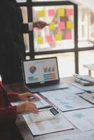 Finance manager meeting discussing company growth project success financial statistics, professional investor working start up project for strategy plan with document, laptop and digital tablet. photo