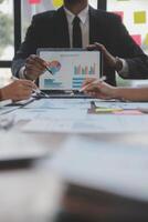 Finance manager meeting discussing company growth project success financial statistics, professional investor working start up project for strategy plan with document, laptop and digital tablet. photo