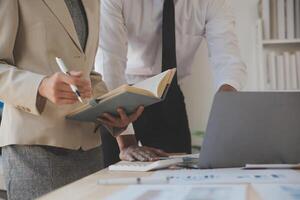 Finance manager meeting discussing company growth project success financial statistics, professional investor working start up project for strategy plan with document, laptop and digital tablet. photo