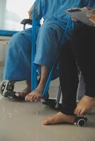 A physiotherapist doing treatment with patient in bright office photo