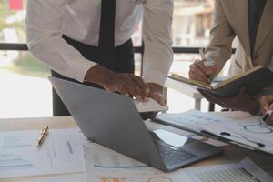 Finance manager meeting discussing company growth project success financial statistics, professional investor working start up project for strategy plan with document, laptop and digital tablet. photo