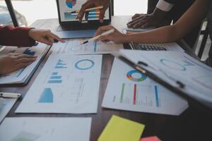 Finance manager meeting discussing company growth project success financial statistics, professional investor working start up project for strategy plan with document, laptop and digital tablet. photo