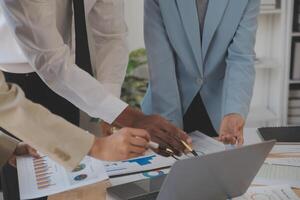 Finance manager meeting discussing company growth project success financial statistics, professional investor working start up project for strategy plan with document, laptop and digital tablet. photo