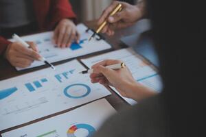 Finance manager meeting discussing company growth project success financial statistics, professional investor working start up project for strategy plan with document, laptop and digital tablet. photo