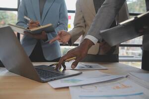 Finance manager meeting discussing company growth project success financial statistics, professional investor working start up project for strategy plan with document, laptop and digital tablet. photo