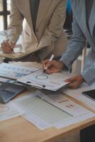 Finance manager meeting discussing company growth project success financial statistics, professional investor working start up project for strategy plan with document, laptop and digital tablet. photo