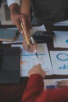 Finance manager meeting discussing company growth project success financial statistics, professional investor working start up project for strategy plan with document, laptop and digital tablet. photo