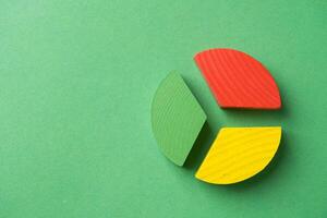 Colorful wooden pie chart pieces photo