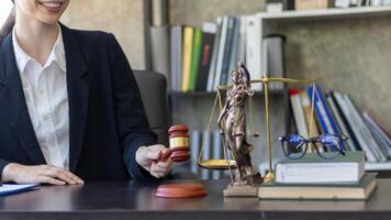 judge holds givel wood tapped on the wooden base to read verdict for victims and defendants to know the verdict obtained from the evidence and the lawyer's defense of the case. court decision concept photo