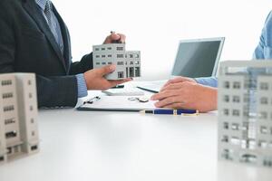 Real estate agents are selling real estate clients and offering condominiums buyers as long term rental investments help reduce burden paying installments. Investment property trading long term rental photo