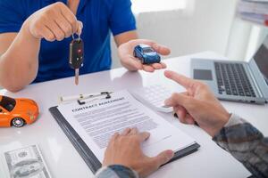 Car dealers recommend car to customers before entering into sales contracts so that customers can get the car they like before paying contract money. Concept of making sales contract with distributor photo