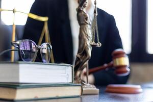 judge holds givel wood tapped on the wooden base to read verdict for victims and defendants to know the verdict obtained from the evidence and the lawyer's defense of the case. court decision concept photo