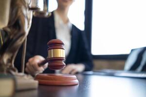 judge holds givel wood tapped on the wooden base to read verdict for victims and defendants to know the verdict obtained from the evidence and the lawyer's defense of the case. court decision concept photo