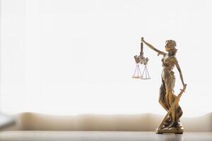 statue of god Themis Lady Justice is used as symbol of justice within law firm demonstrate truthfulness of facts and power to judge without prejudice. hemis Lady Justice symbol of honesty and justice. photo