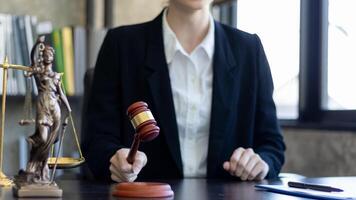 A judge gavel is prepared in the courtroom to be used to give a signal when the verdict is read after the trial is completed. Concept judge gavel is prepared to symbolize the decision in a court case. photo