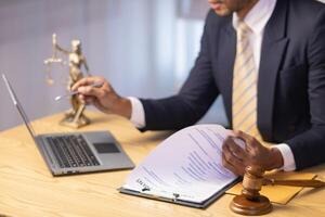 A judge gavel is prepared in the courtroom to be used to give a signal when the verdict is read after the trial is completed. Concept judge gavel is prepared to symbolize the decision in a court case. photo