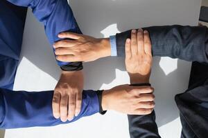 Businessmen and investors shake hands as symbol of joint venture after discussing, consulting and making contract to invest in business together. business people shaking hands as symbol of cooperation photo