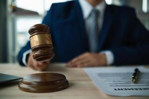 A judge gavel is prepared in the courtroom to be used to give a signal when the verdict is read after the trial is completed. Concept judge gavel is prepared to symbolize the decision in a court case. photo