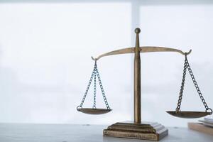 Brass scales are placed on lawyers desks in legal advice offices as a symbol of fairness and integrity in the High Court decision making. Brass scales were used as a symbol of honesty and justice. photo