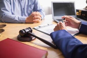 A judge gavel is prepared in the courtroom to be used to give a signal when the verdict is read after the trial is completed. Concept judge gavel is prepared to symbolize the decision in a court case. photo