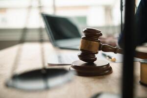 A judge gavel is prepared in the courtroom to be used to give a signal when the verdict is read after the trial is completed. Concept judge gavel is prepared to symbolize the decision in a court case. photo