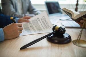 A judge gavel is prepared in the courtroom to be used to give a signal when the verdict is read after the trial is completed. Concept judge gavel is prepared to symbolize the decision in a court case. photo