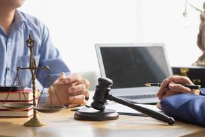 A judge gavel is prepared in the courtroom to be used to give a signal when the verdict is read after the trial is completed. Concept judge gavel is prepared to symbolize the decision in a court case. photo