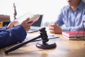 A judge gavel is prepared in the courtroom to be used to give a signal when the verdict is read after the trial is completed. Concept judge gavel is prepared to symbolize the decision in a court case. photo