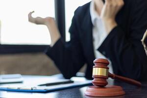 A judge gavel is prepared in the courtroom to be used to give a signal when the verdict is read after the trial is completed. Concept judge gavel is prepared to symbolize the decision in a court case. photo
