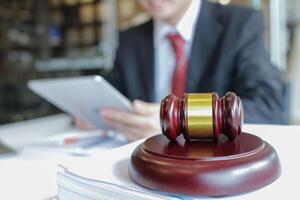 A judge gavel is prepared in the courtroom to be used to give a signal when the verdict is read after the trial is completed. Concept judge gavel is prepared to symbolize the decision in a court case. photo