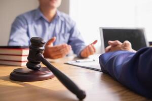 A judge gavel is prepared in the courtroom to be used to give a signal when the verdict is read after the trial is completed. Concept judge gavel is prepared to symbolize the decision in a court case. photo