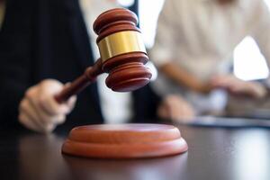 A judge gavel is prepared in the courtroom to be used to give a signal when the verdict is read after the trial is completed. Concept judge gavel is prepared to symbolize the decision in a court case. photo