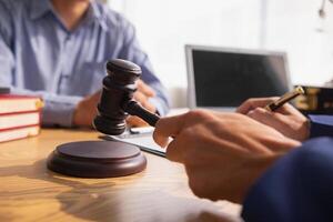 A judge gavel is prepared in the courtroom to be used to give a signal when the verdict is read after the trial is completed. Concept judge gavel is prepared to symbolize the decision in a court case. photo