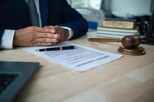 A judge gavel is prepared in the courtroom to be used to give a signal when the verdict is read after the trial is completed. Concept judge gavel is prepared to symbolize the decision in a court case. photo