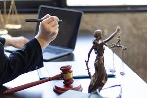 A judge gavel is prepared in the courtroom to be used to give a signal when the verdict is read after the trial is completed. Concept judge gavel is prepared to symbolize the decision in a court case. photo