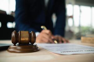 A judge gavel is prepared in the courtroom to be used to give a signal when the verdict is read after the trial is completed. Concept judge gavel is prepared to symbolize the decision in a court case. photo