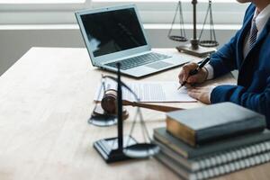 contract was placed on table inside legal counsel's office, ready for investors to sign the contract to hire a team of lawyers to provide legal advice for their investment. legal consulting concept photo