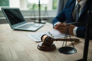 A judge gavel is prepared in the courtroom to be used to give a signal when the verdict is read after the trial is completed. Concept judge gavel is prepared to symbolize the decision in a court case. photo