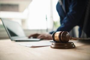 A judge gavel is prepared in the courtroom to be used to give a signal when the verdict is read after the trial is completed. Concept judge gavel is prepared to symbolize the decision in a court case. photo