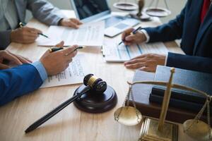 A judge gavel is prepared in the courtroom to be used to give a signal when the verdict is read after the trial is completed. Concept judge gavel is prepared to symbolize the decision in a court case. photo